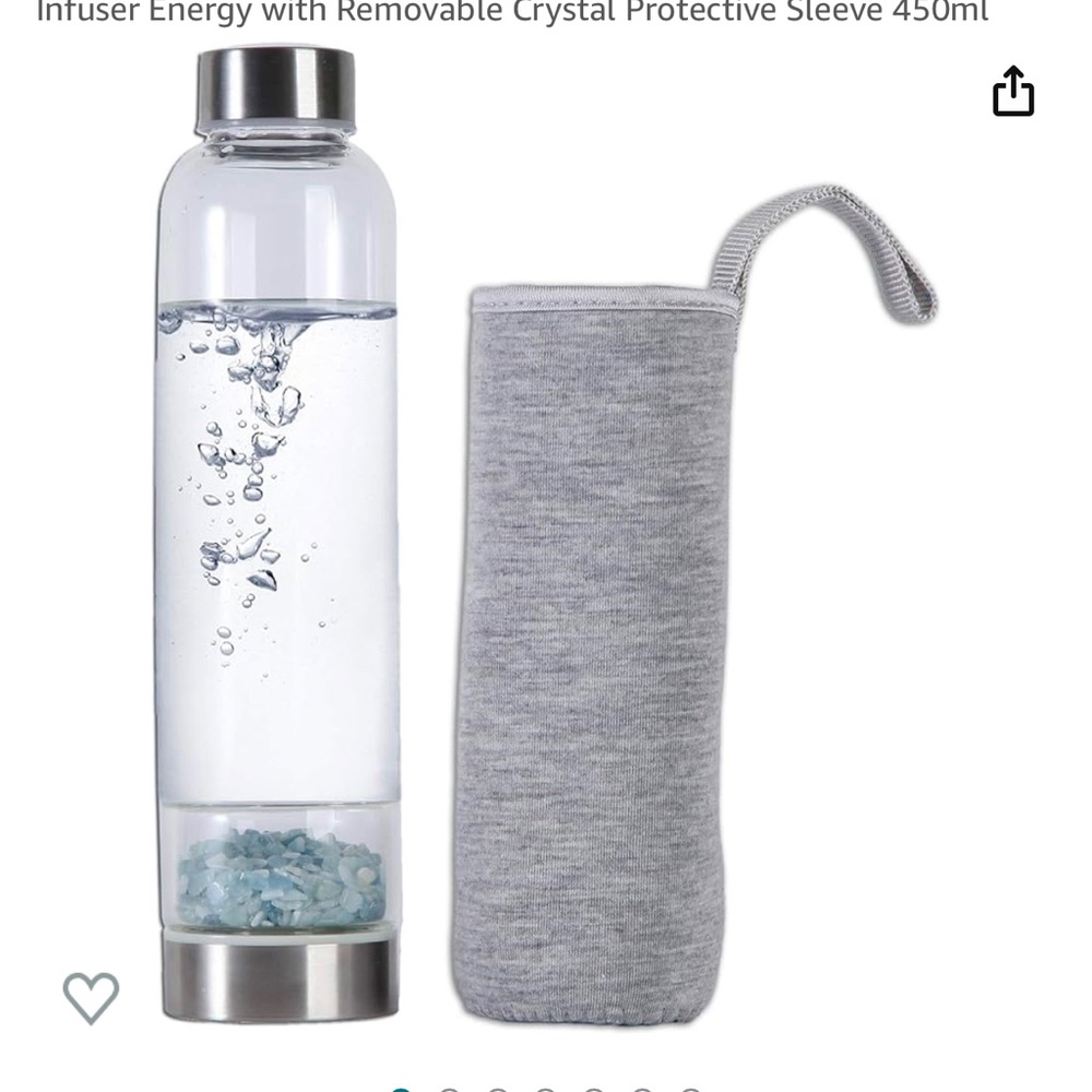 Glass crystal water bottle filled with amethyst or aquamarine gems